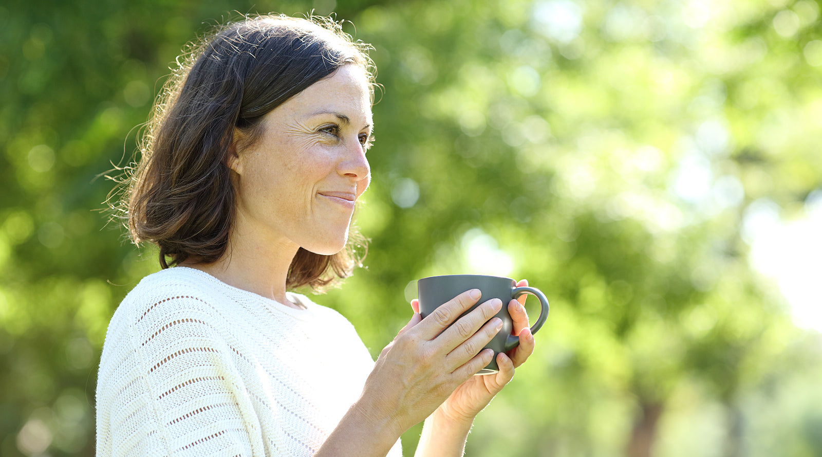 Adult woman standing outside learning how to manage stress