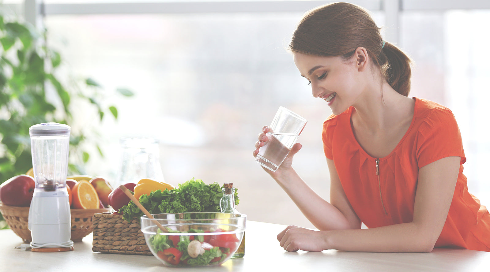 Young woman drinking a shake and listening to music after a workout.