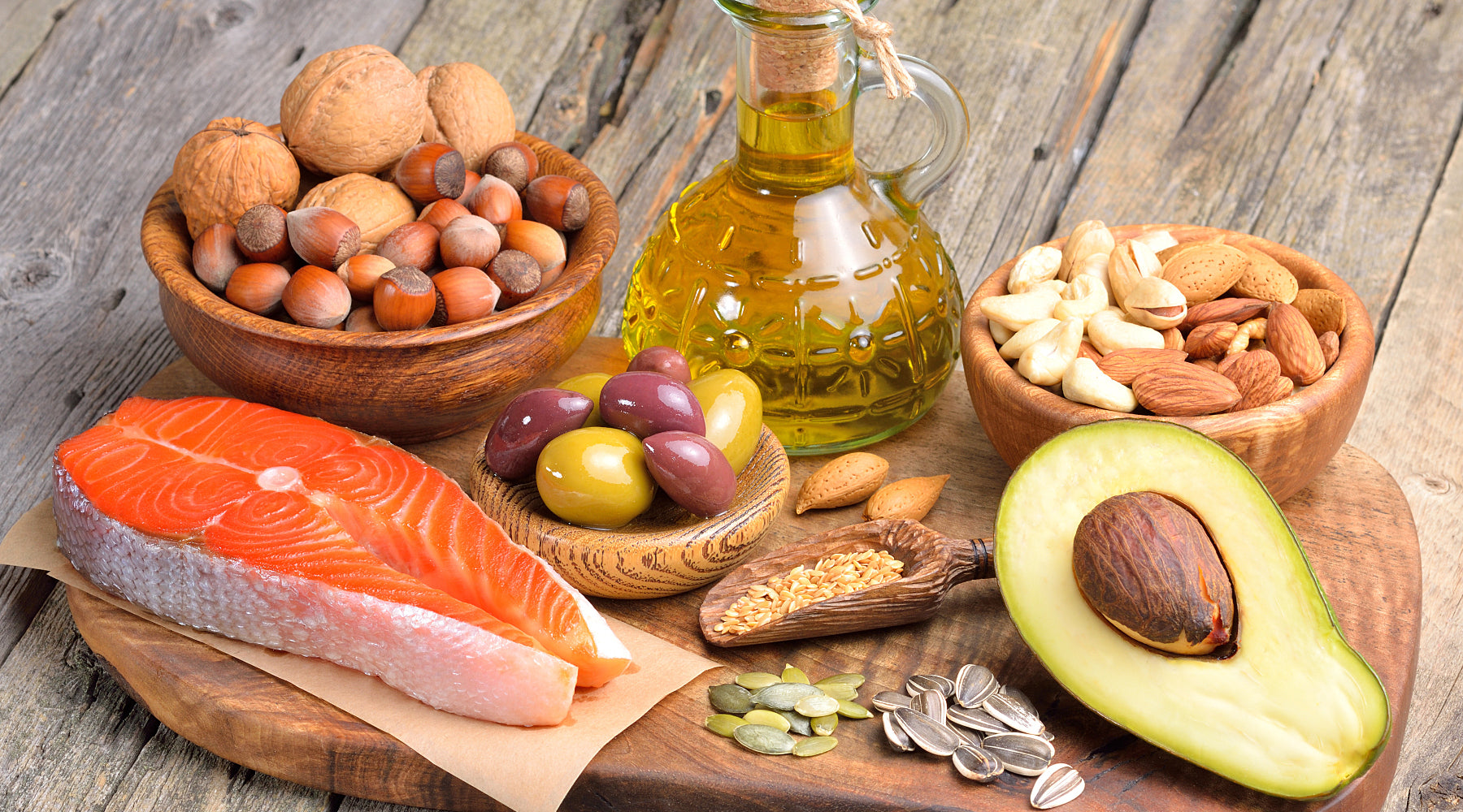 Sources of healthy fats - avocado, oily fish and nuts and seeds